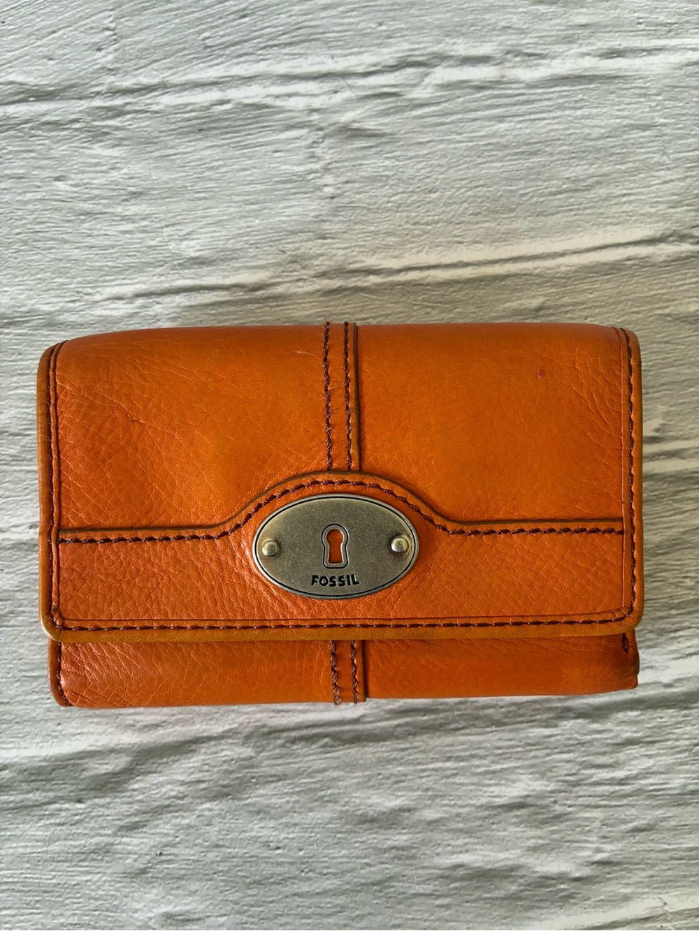 Fossil Orange Leather Trifold Wallet With Keyhole Plaque
